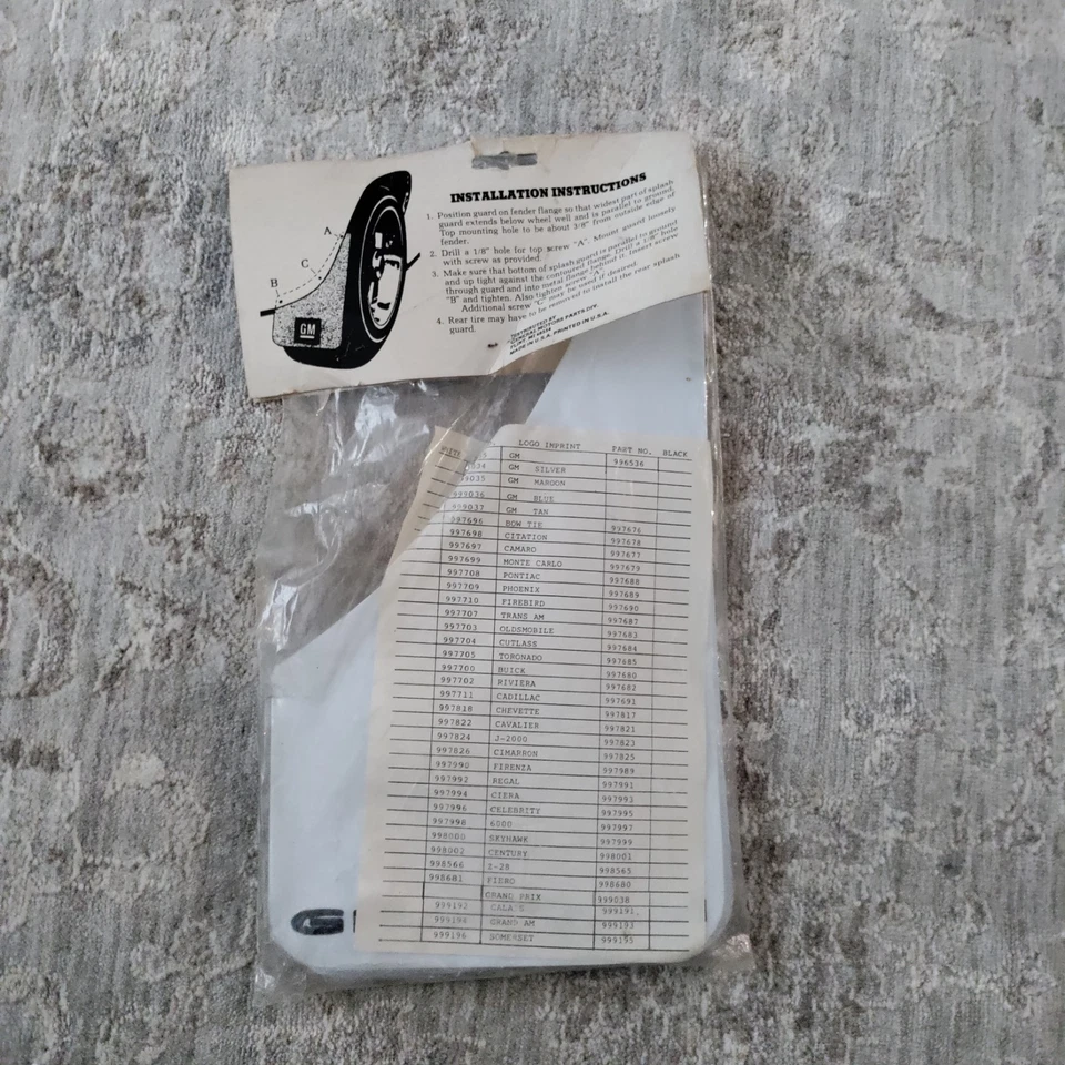 Nos GM protectores contra salpicaduras guardabarros Pontiac Grand Am blanco con letras negras 999194 Foto 4 de 4