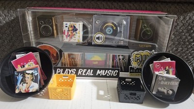 (1) MGA miniverse Real Music Record Player and (8) Records