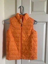 New with tags Amazon Essentials Boys Lightweight Puffy Vest size large orange