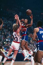 Guard Lloyd Free passes off against Larry Bird 1980's Basketball photo