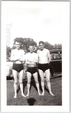 1950s Black And White Photo Of Three Men In Suits Getting Ready To Go Swimming