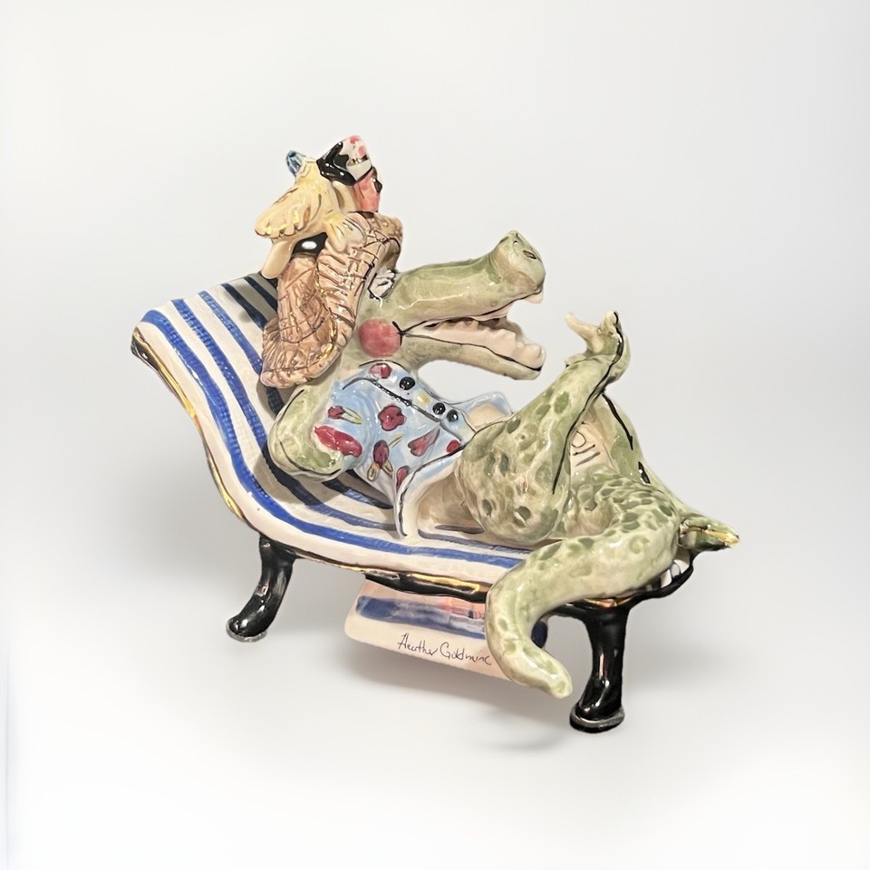 Heather Goldminc's folk-art alligator music box is a retired, hard-to-find piece from a beloved ceramic artist — genuinely rare and wildly charming.