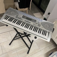 Casio CTK-691 Keyboard, Power Supply, and Music Stand in good working order 
