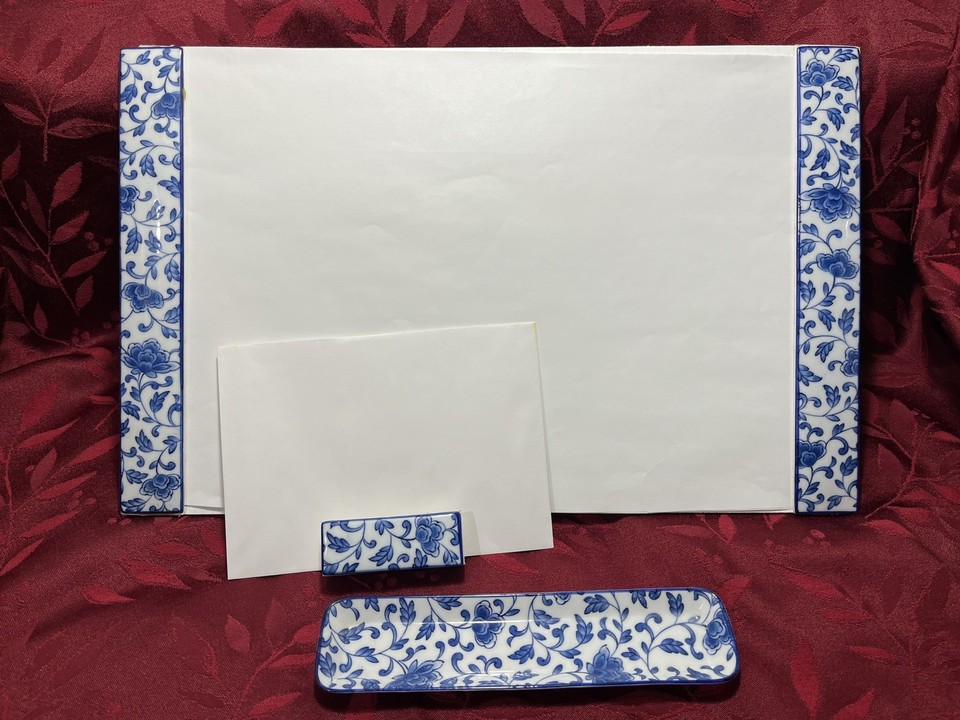 A three-piece Japanese porcelain desk set still wearing its original sticker — a pristine mid-century find that's almost too good to actually use.