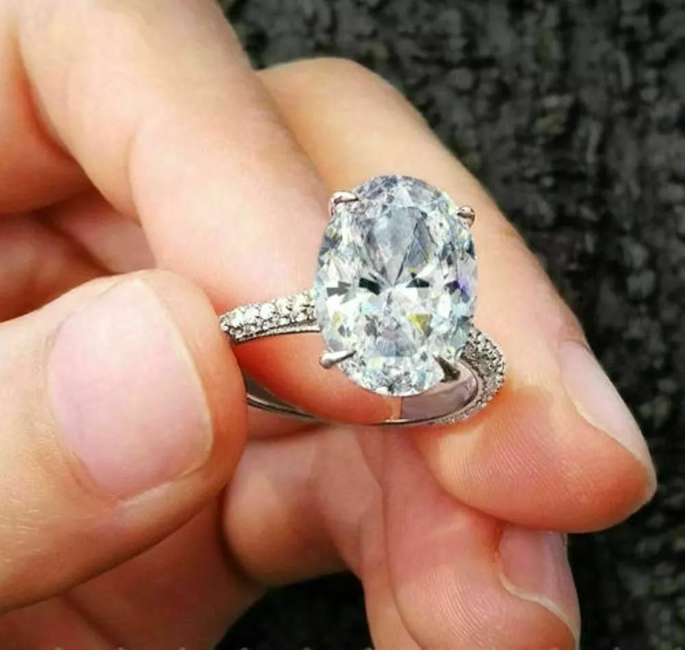 Oval moissanite hidden sale halo