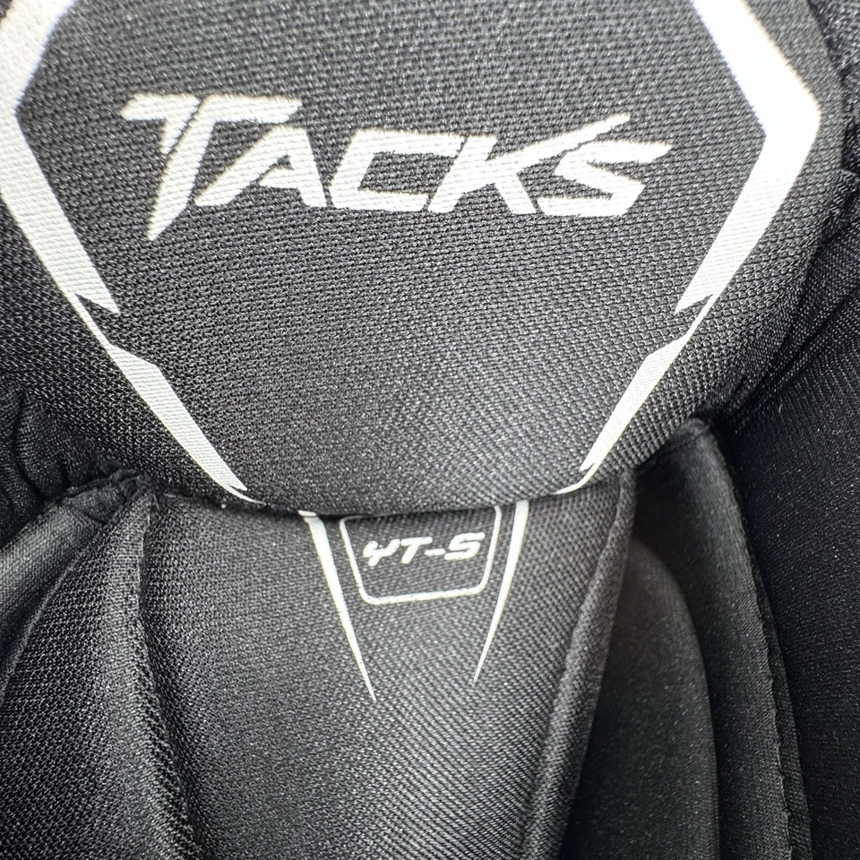 Pantalones de hockey pequeños para jóvenes Tacks CCM botones de cinturón negro Foto 3 de 4