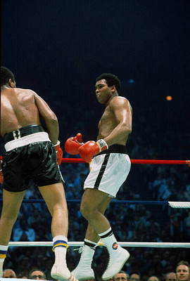 Mohammad Ali and Jimmy Young battle each other at the WBC and WBA- 1976 Photo