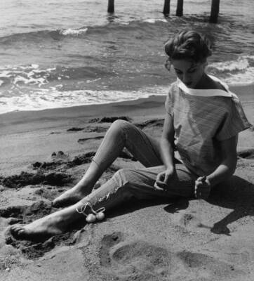 Woman sitting beach wearing blouse trousers by Fabiani Italy Augus- Old Photo