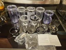 Lot Of 16 Pieces Nutribullet Assorted Cups & Lids / Tops + 1 Blade (Untested)