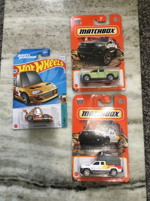 toyota lot hot wheels & matchbox cars: '94 supra tooned, '16 tacoma, '18 hilux