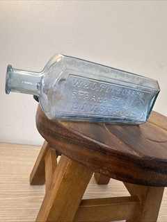 collectible antique aqua glass bottle likely from the Victorian era Liverpool