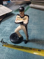 VTG. EARNHART FIGURE STANDING ON A TIRE