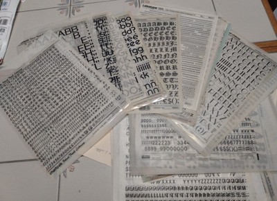 Large collection of press type, adhesive letters, and stencils for arts & crafts