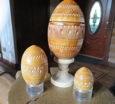 Nested carved Wood Eggs, set of 3. Design. Top and bottom.