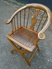 Chinese hardwood bow back chair with ornate pattern to back rest beautiful