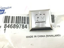 GM Mark of Excellence chrome 1 inch square Fender Emblem new OEM 84689784