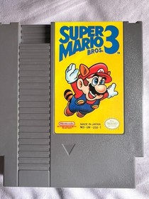 NES Console (Not working) Bundle  &ndash; Includes Zapper, Game Genie, and 10 Games