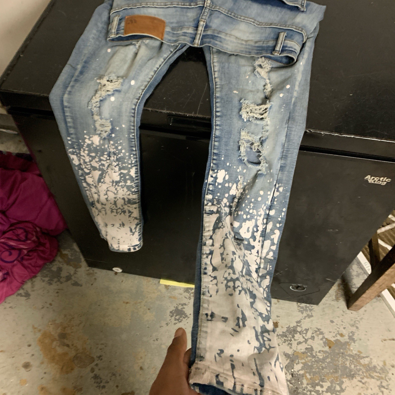 Blue Distressed Denim With White Paint Splatter