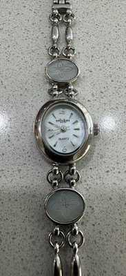 L.A. Express M.Z. Berger women s vintage watch LAX1393 168 PC21 case is 21x18mm.