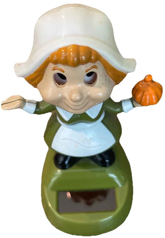 Niña peregrina de acción de gracias de otoño con energía solar Foto 2 de 4