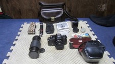 nikon em 35mm camera with accessories zoom lens owners manual and carry case