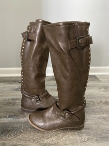 riding boots with red zipper in back