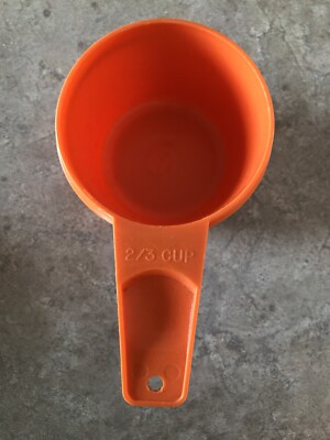 Tupperware 2/3 Cup Orange Measuring Cup used