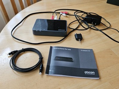 oticon TV sound streamer to your hearing aids.  2''x 4''x 3/4'' black box