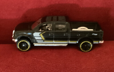 2012 hot wheels ‘09 Ford F-150 black die cast truck