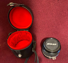 Nikon 24MM, 1:28 lens with lether padded case