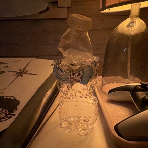 water bottle burned into an art piece