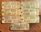 (7) Vintage Luberite Motor Oil Brass Gas Station Tags / Signs