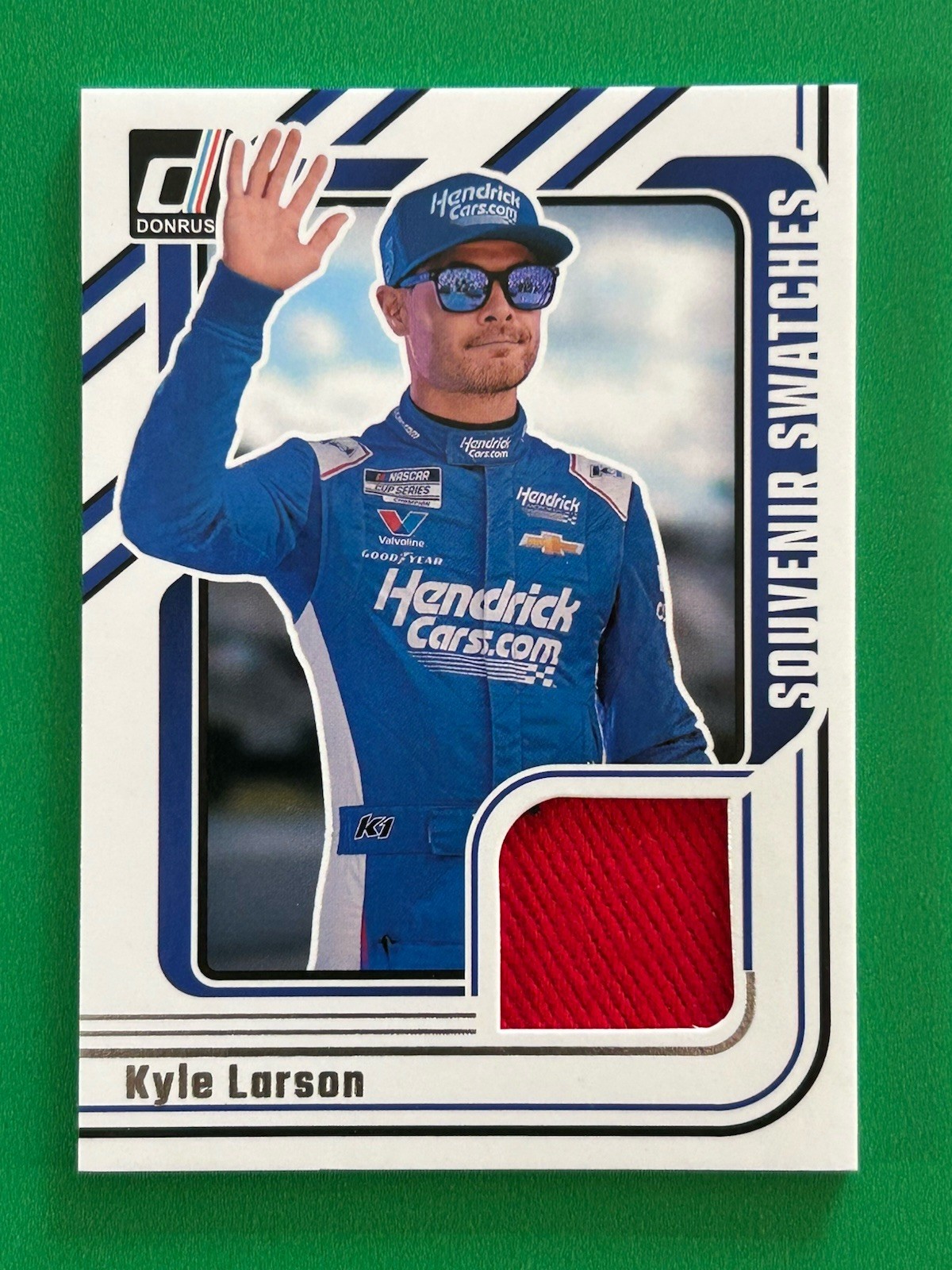 Kyle Larson 2026 Panini Donruss (SP,MEM) Souvenir Swatches #SVS-KLN Hendricks