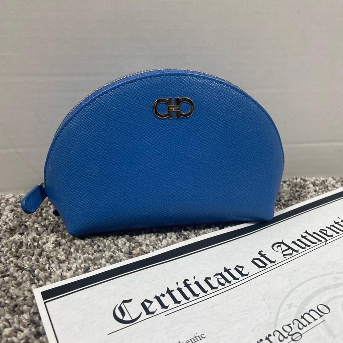 Authentic SALVATORE FERRAGAMO Blue leather pouch bag with duster