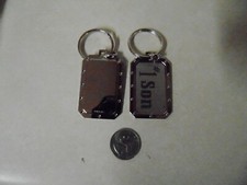 DOG TAG SHAPED KEY CHAIN 1 SON ABOUT 2 INCHES