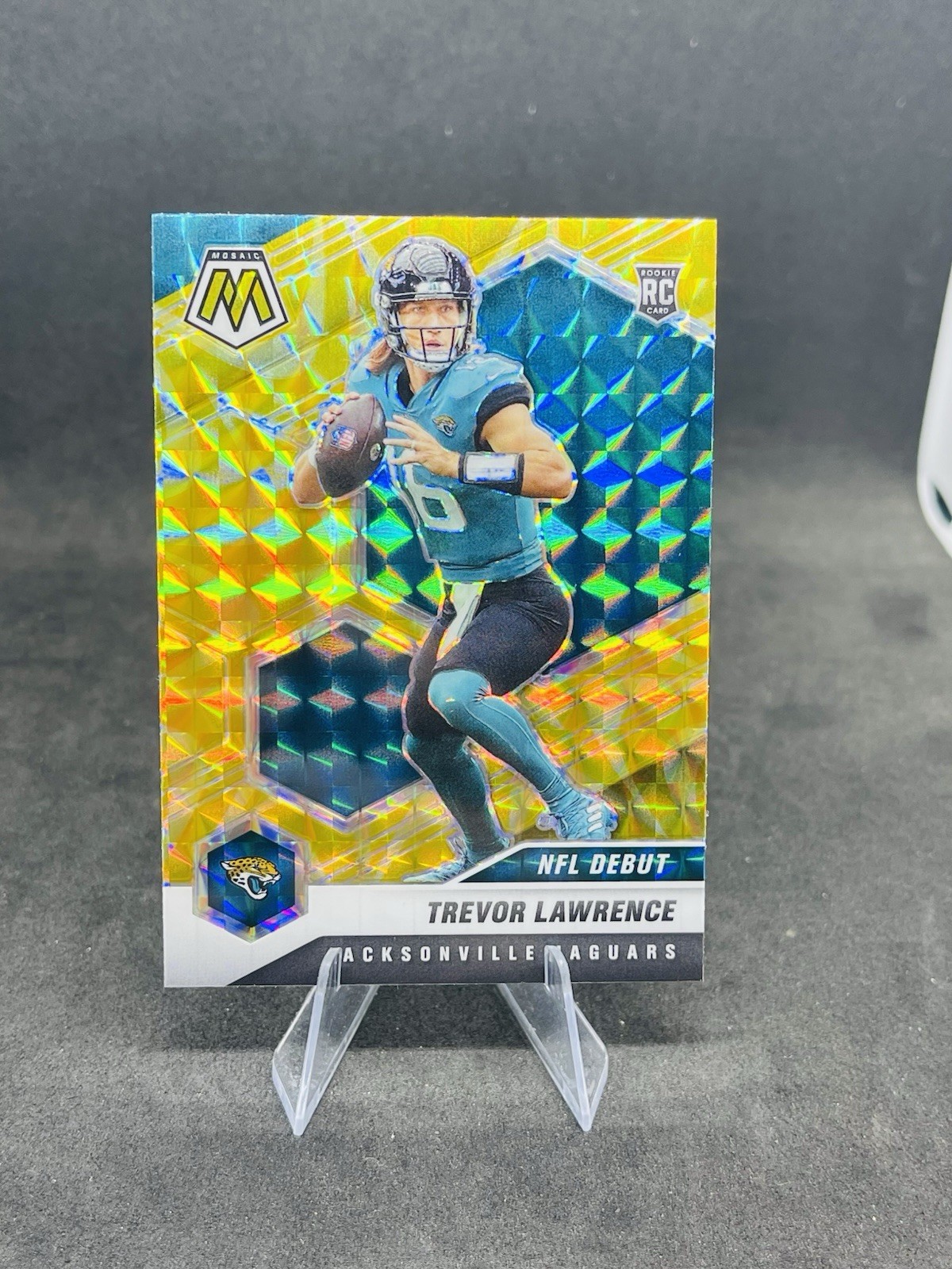 2021 Panini Mosaic NFL Debut Trevor Lawrence 241 Reactive Yellow Mosaic Prizm RC