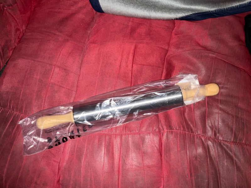 Stainless steel rolling pin with wood handles. brand new