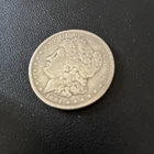 11 Morgan Silver Dollars.