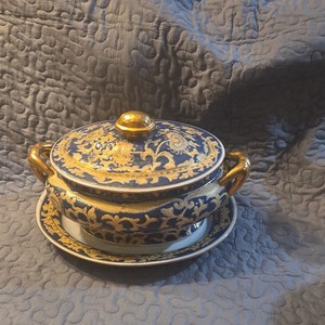 vintage porcelain tureen featuring an intricate blue and gold floral design