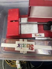 Sizzix System- Die Cutting Machine With Die Cutters And Paddle Cutters