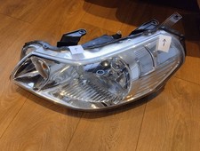 2009 SUZUKI SX4 — left headlight, part number 100-16684, comes with a defect