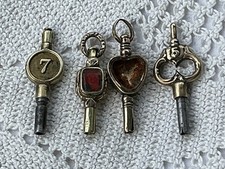 TWO ANTIQUE GEORGIAN GOLD CASED REPOUSSE DESIGN POCKET WATCH KEYS & 2 OTHERS 