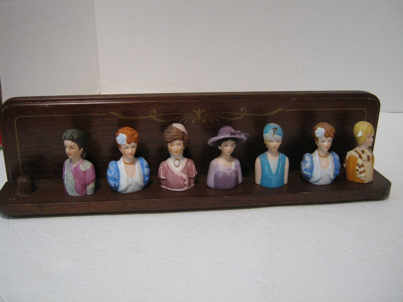 Vintage Avon American Fashion Thimbles (set of 7 ) and Mahogany Rack Display