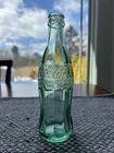2 Vintage Coca Cola bottles - 1915  Woonsocket RI & 1929 New York Hobbleskirt