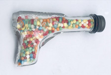 TH Stough Co Glass Ray Gun Bottle Full w/ Candy & Screw Top Jeannette PA 3.75"