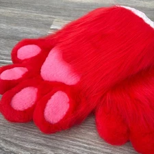 The animal's fluffy red paws were made by hand. SALE