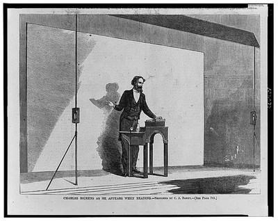 Photo:Charles Dickens as he appears when reading