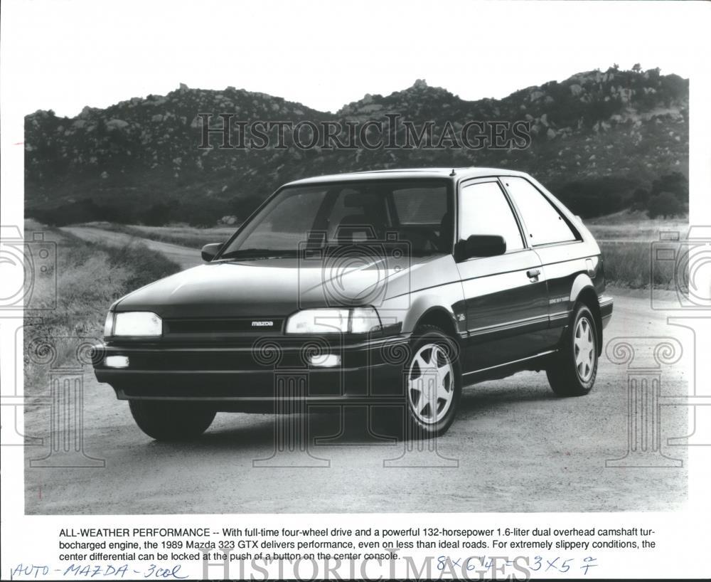 1989 Press Photo Mazda 232 GTX: front-quarter view of 'Peppy' new