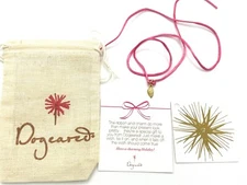 Dogeared wish bracelet w/ angel wing charm on the pink string