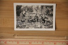 Photograph Military World War II era with GI's resting Snapshot writing on back